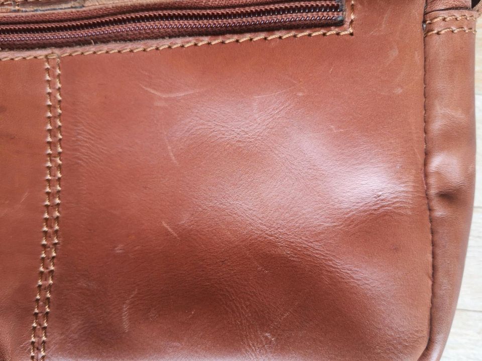 Leder-Handtasche, Saddle Bag, Quaste, cognac-braun in Köln