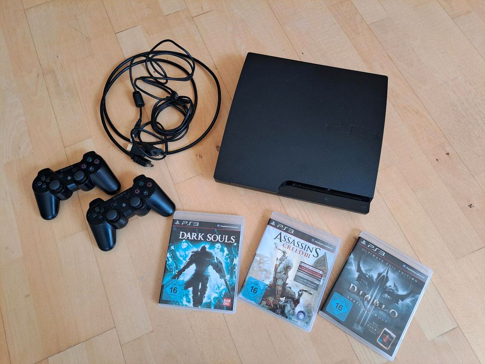 PS3, Playstation 3 inkl Controller & 3 Spielen in Neuss
