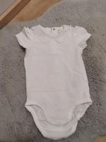 Body Gr. 74 H&M kurzarm weiss Mädchen Kragen Spitze Sommer Nordrhein-Westfalen - Morsbach Vorschau