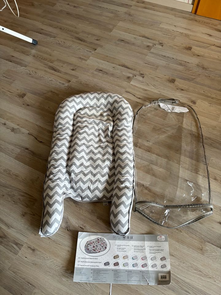 Verkaufe ein Babynest Polini in grau/weiss wenig gebraucht in Cloppenburg