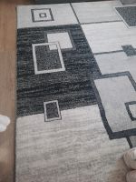 Grauer schwarzer karierter Teppich  1.60 × 2 m Sachsen-Anhalt - Dessau-Roßlau Vorschau