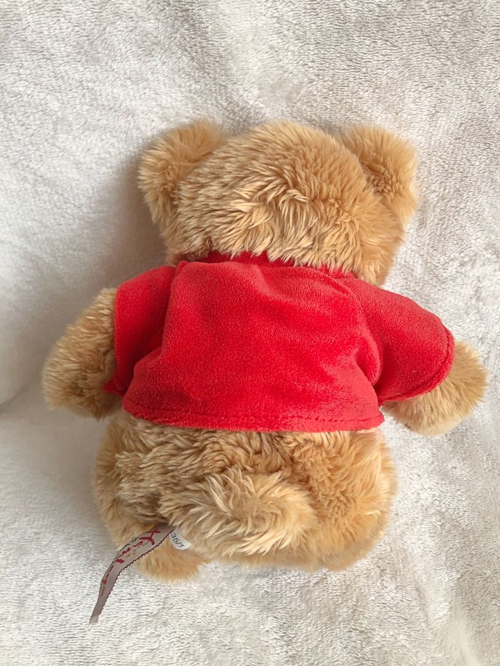 Hamleys Teddybär mit rotem Shirt, Sehr guter Zustand, ca. 25 cm in Mering