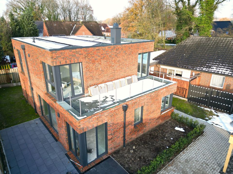 Neubau-Architektenhaus nach KfW 40+ mit PV-Anlage und Carport in Edewecht in Edewecht