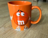 M&M‘s Becher in orange aus Sammlung Kiel - Ravensberg-Brunswik-Düsternbrook Vorschau