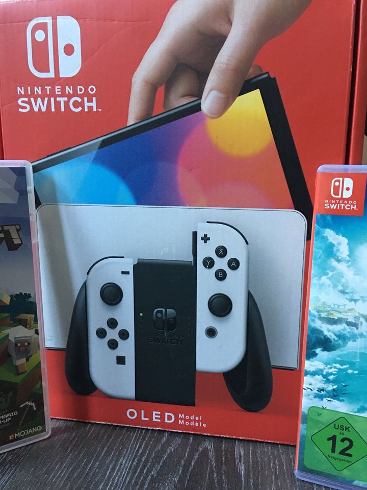 Nintendo Switch Oled Pack + 10 Spiele + Pro Controller in Hamburg