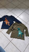 2 Shirts mit Pailletten, Tiger, Dino, topolino, 110 Nordrhein-Westfalen - Pulheim Vorschau