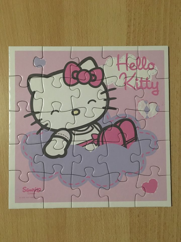 Vier Puzzles von Hello Kitty im Koffer in Osnabrück