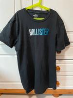 Schwarzes Hollister T-Shirt mit blauem Farbverlauf Schriftzug L Hessen - Kassel Vorschau