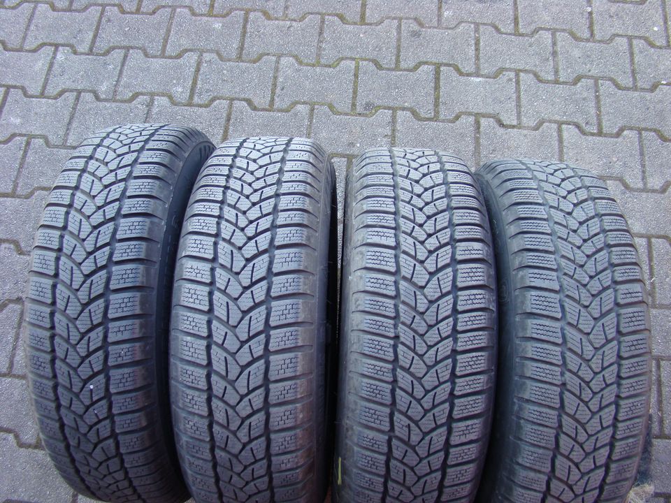 4 Räder Opel Corsa D / 185/65 R15 88T M+S Firestone +  6x15 ET39 in Darmstadt