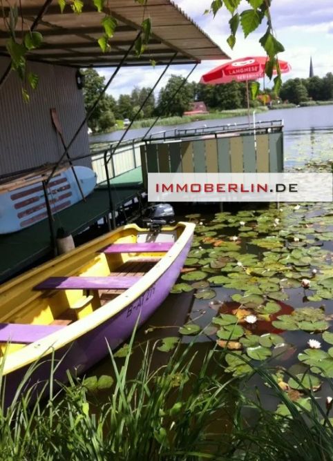 IMMOBERLIN.DE - Zauberhafte Aussichten! Massives Haus + Bootshaus mit 2 Booten auf Wassergrundstück in Groß Köris