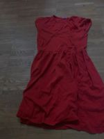 Ein rotes Kleid mit einer roten Blume Düsseldorf - Pempelfort Vorschau