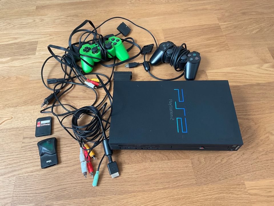 PS2 mit Spielen und Zubehör in München