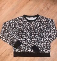 Guess Mädchen Pulli Sweatshirt neuwertig Gr. 140 animalprint Rheinland-Pfalz - Kleinniedesheim Vorschau