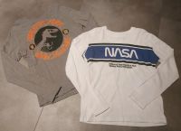 2 Langarmshirts Gr.134/140 NASA und Jurassic Park Nordrhein-Westfalen - Hünxe Vorschau