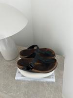 Birkenstock Zehentrenner Sandalen Gizeh schwarz glänzend Gr. 38 Schleswig-Holstein - Puls Vorschau