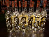 12 Flaschen als Tischnummern inkl. Flaschenlichter Hochzeit München - Moosach Vorschau