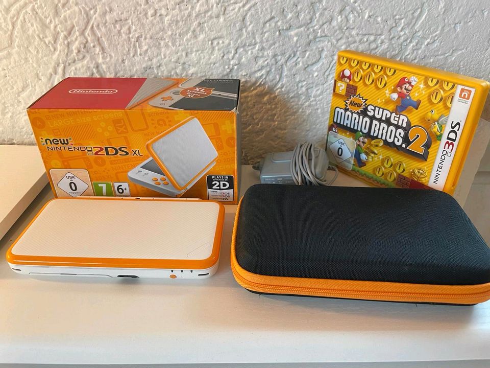 New Nintendo 2DSXL, weiß-orange, neuwertig in Sauerlach