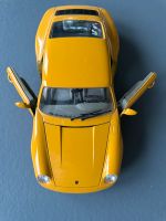 BURAGO Porsche 911 Carrera (1993) Modellauto 1:18 gelb Baden-Württemberg - Böblingen Vorschau