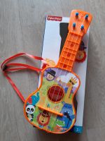 Kindergitarre Gitarre 4-saitig Musikinstrument Fisher Price Dresden - Klotzsche Vorschau