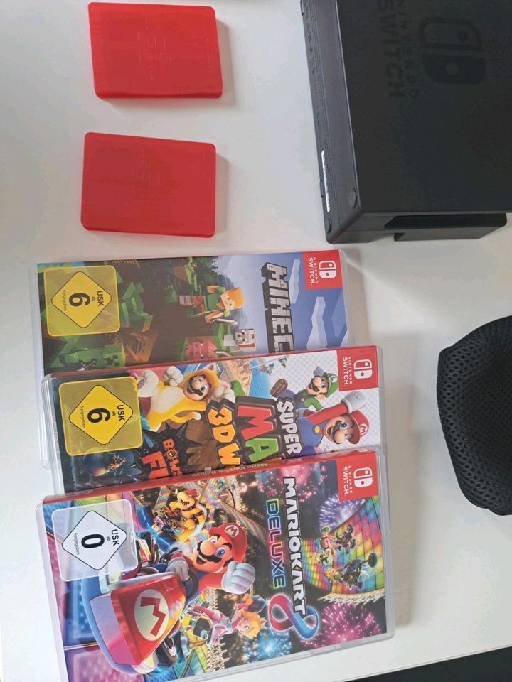 Nintendo switch mit koffer und 3 spielen in Hanau