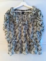 Bluse blau Volant Vögel H&M Größe 38 Nordrhein-Westfalen - Brühl Vorschau