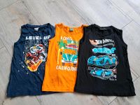 3 Tanktops / Shirts Größe 122 Niedersachsen - Großheide Vorschau